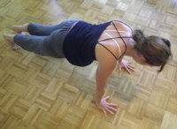 Laura Taliaferro practices caturanga dandharsana in Maui