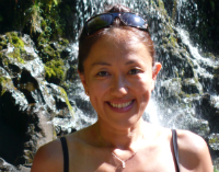 Yoko Nagashima sitting beneath waterfall at Bamboo Forest in Huelo, Maui Yoko Nagashima sitting beneath waterfall at Bamboo Forest in Huelo, Maui