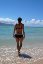 Yoko Nagashima walking into the tropical waters at Kanaha Beach, Maui
