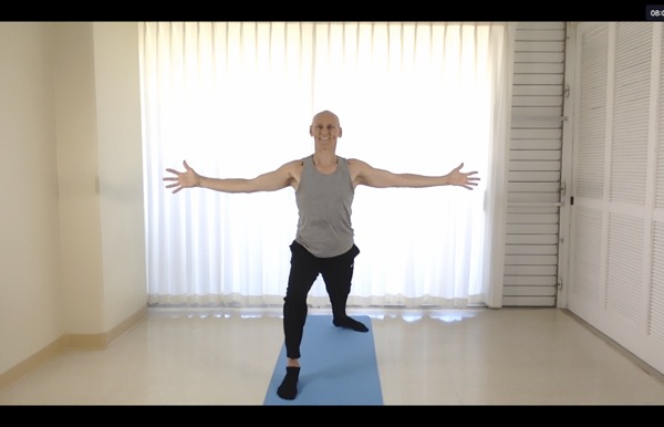 Tedd Surman in virabhadrasana during zoom Yoga class Tedd Surman in virabhadrasana during zoom Yoga class