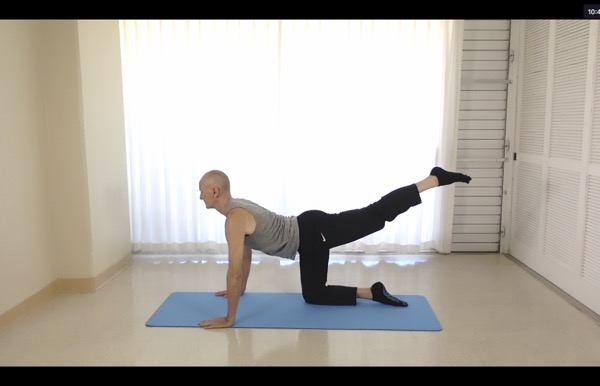 Tedd Surman in cakravakasana during zoom Yoga class Tedd Surman in cakravakasana during zoom Yoga class